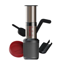 Load image into Gallery viewer, The AeroPress Go gives you all the great brewing capabilities of the original AeroPress and fuels an active lifestyle by packing up neatly in its own mug for delicious coffee anywhere you go.
